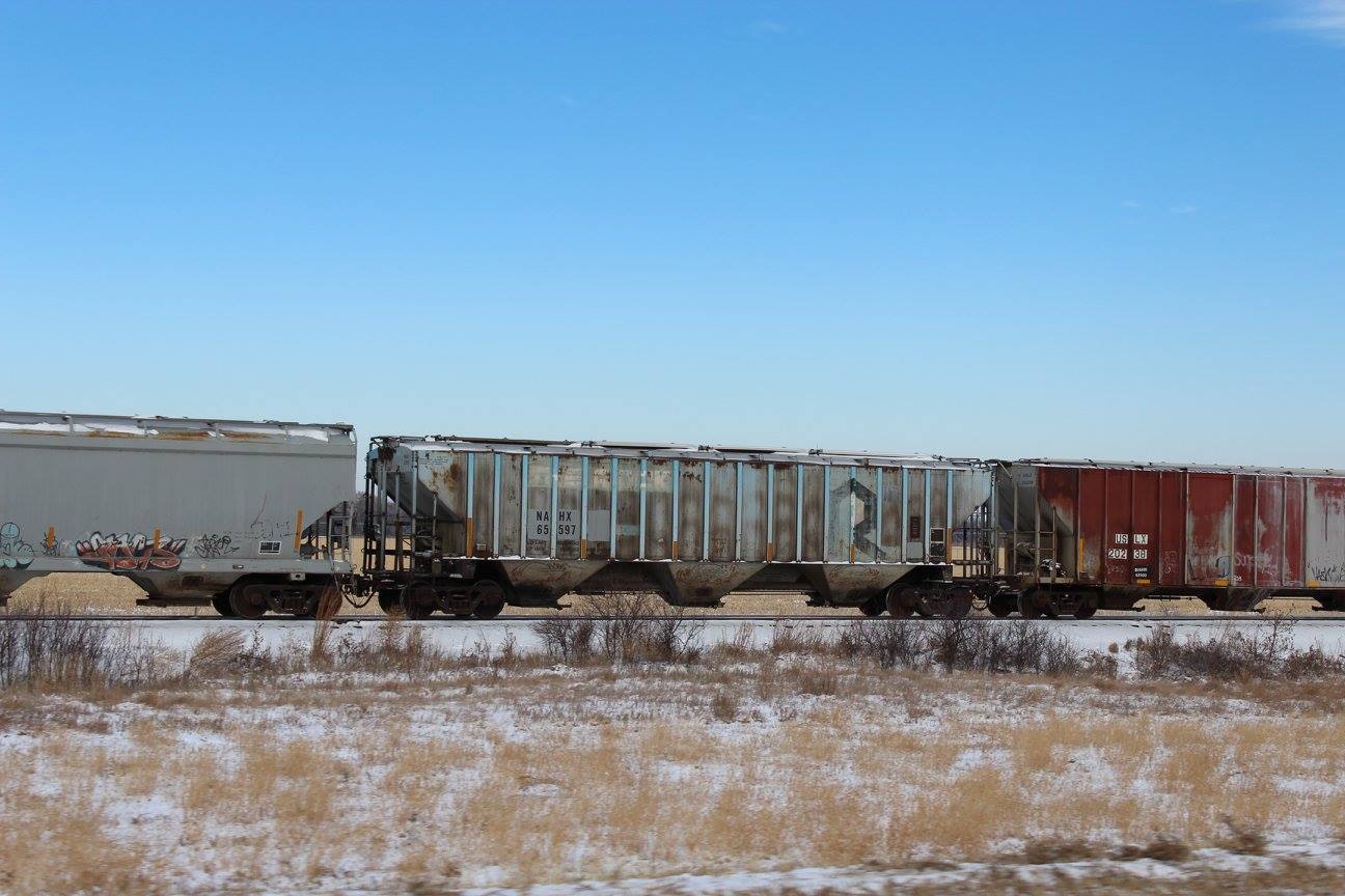 Simple pleasure of watching a grain train go by and playing ...