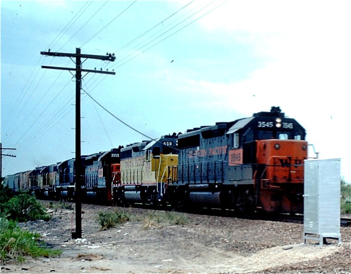 Monahans Sand Hills SP, August, 1984.  West bound UP train with WP, UP, WP, MP, UP, and UP units.